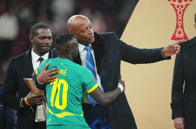Sadio Mane (Senegal) and Patrice Motsepe gesture during the Africa Cup of Nations final match between Morocco and Senegal at Prince Moulay Abdellah Sports Complex in Rabat, Morocco on January 19, 2026.