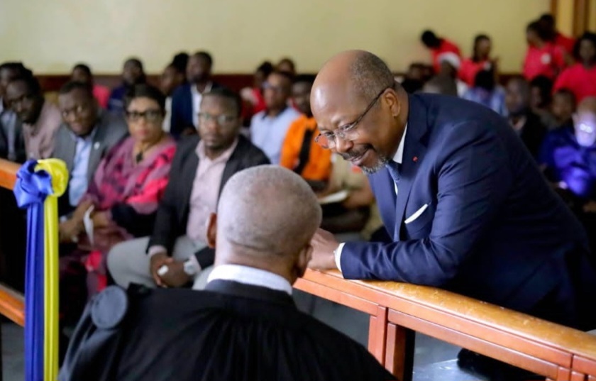 Bilie By Nze and his lawyer during a court hearing