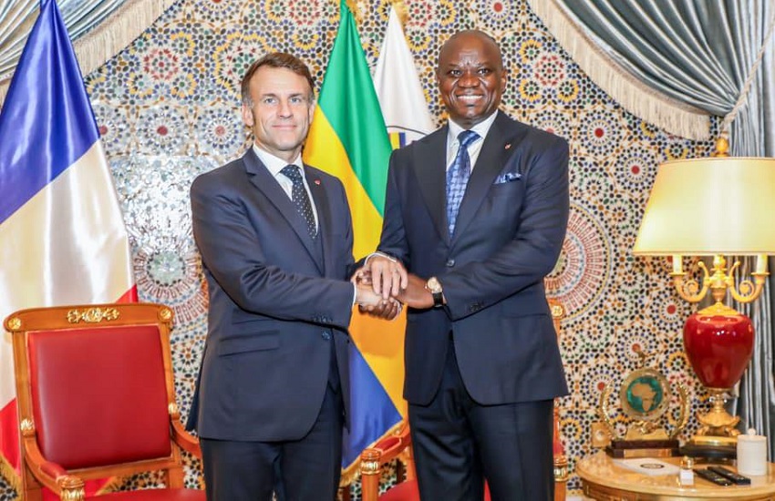 French and Gabonese leaders shaking hands during a diplomatic meeting