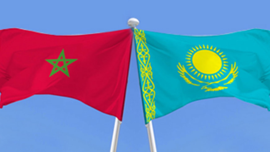 Moroccan and Kazakh officials shaking hands during trade discussions