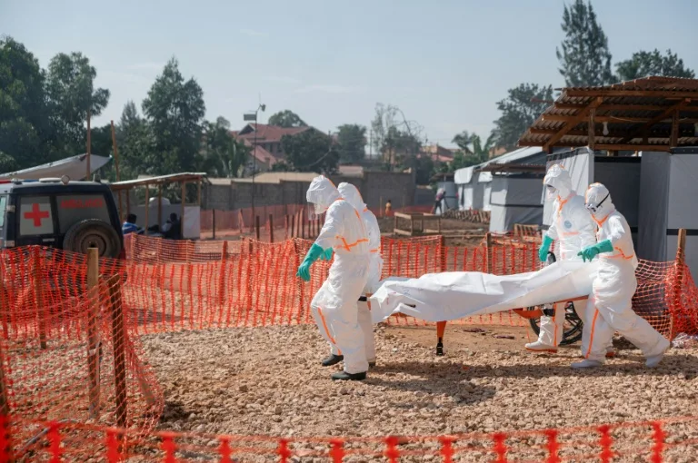 Health workers in protective gear managing an Ebola treatment center in Democratic Republic of Congo