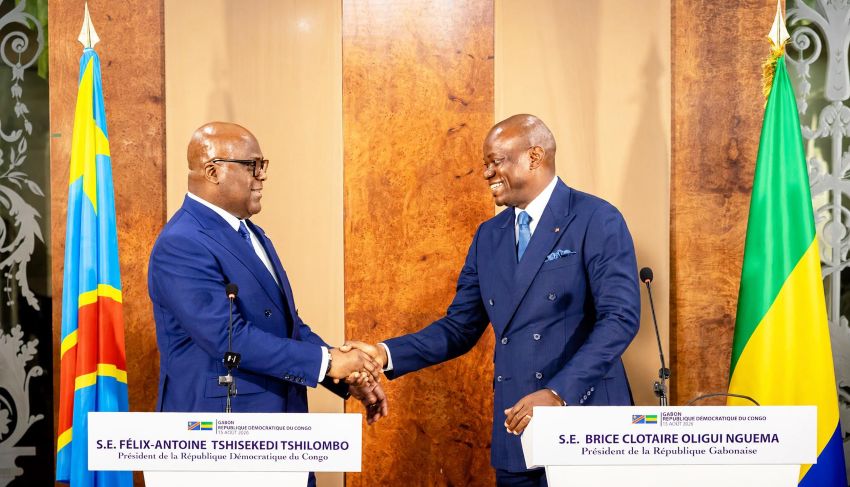 Presidents Oligui Nguema and Tshisekedi shaking hands in Libreville